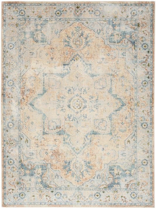 Distressed oriental area rug in pale blue, ivory and peach with a central medallion and ornate border.