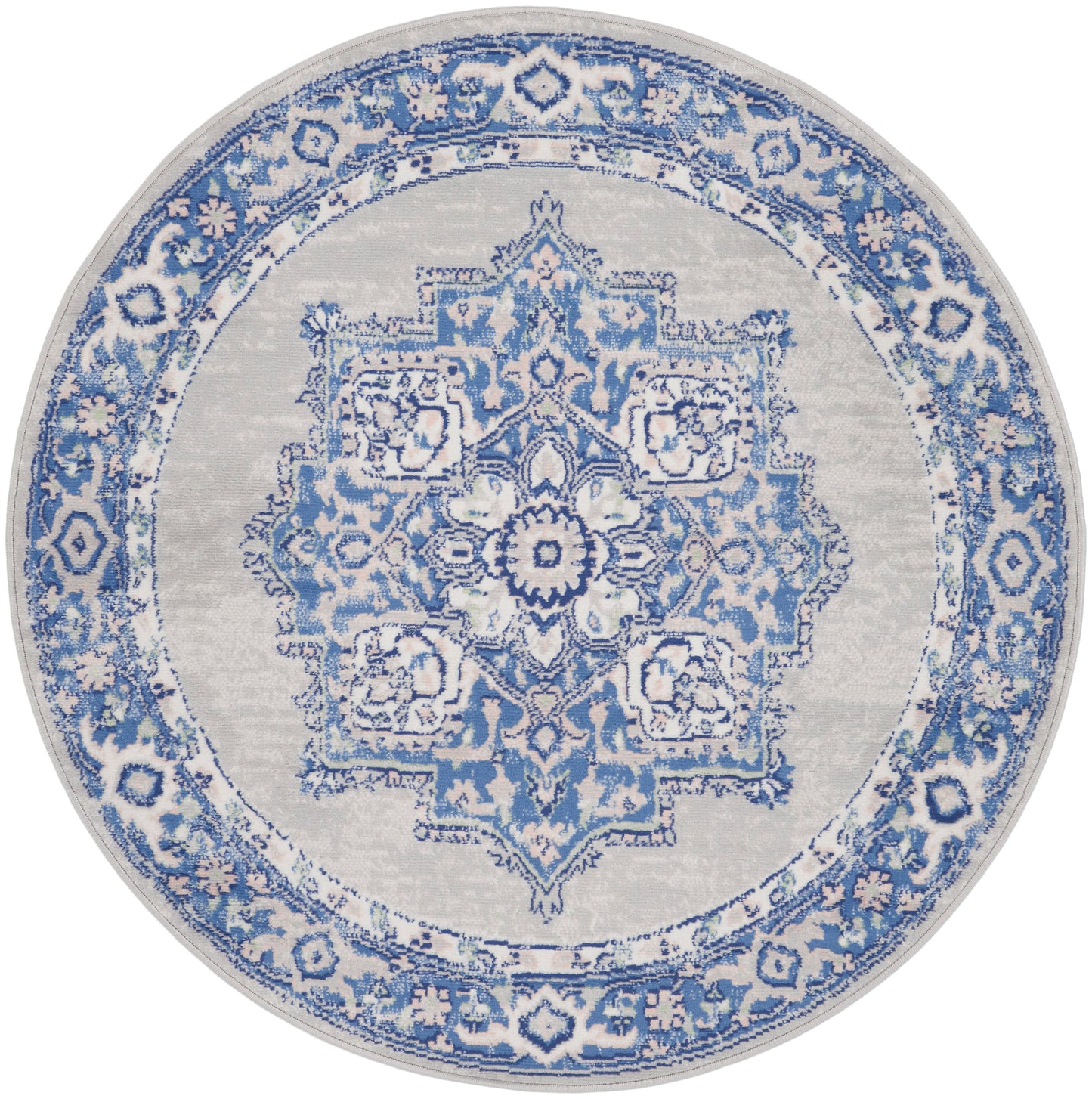 Round blue-and-white oriental rug with intricate central medallion and floral border.