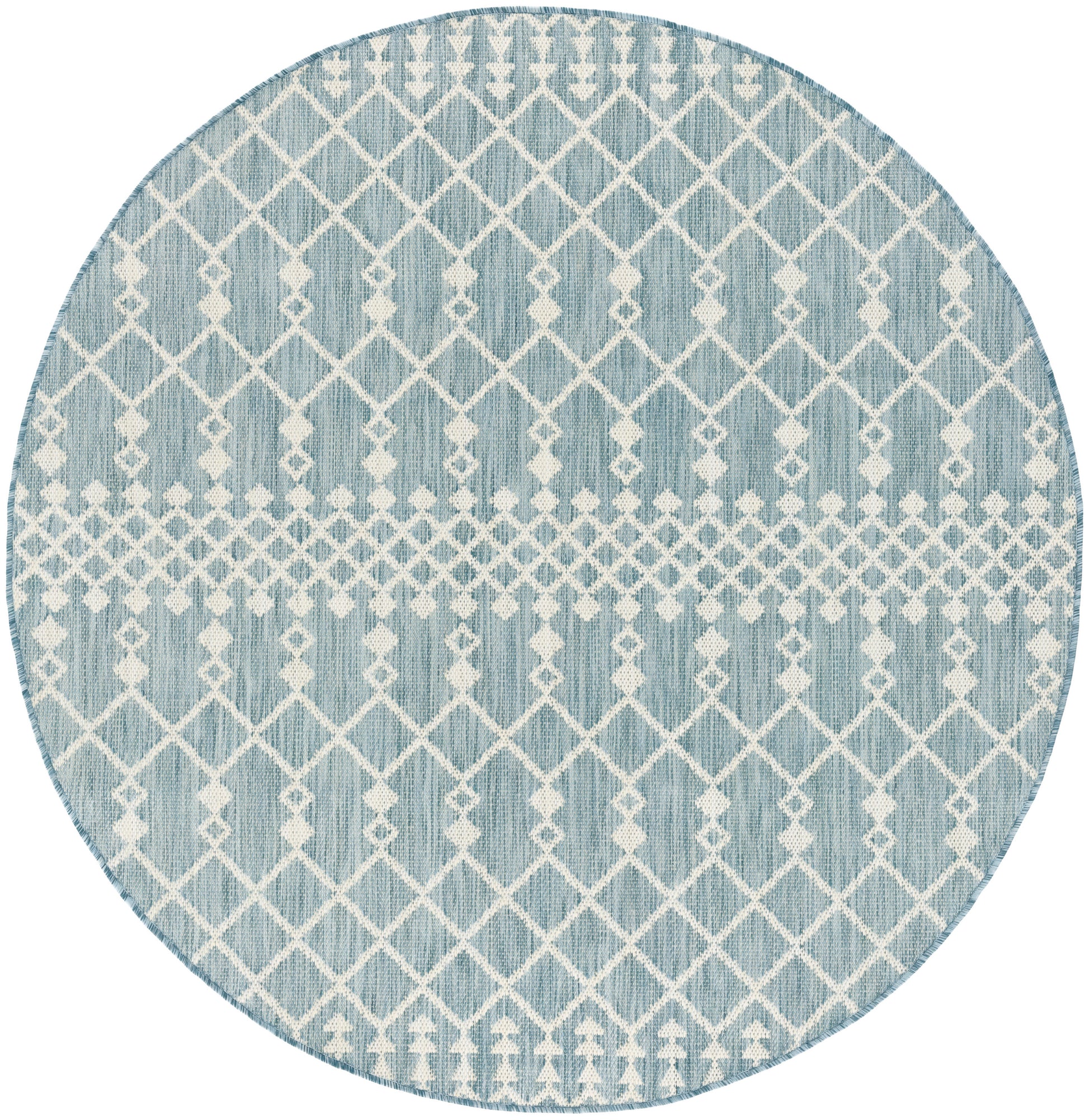 Round light-blue rug with white geometric lattice diamonds; modern coastal decor.