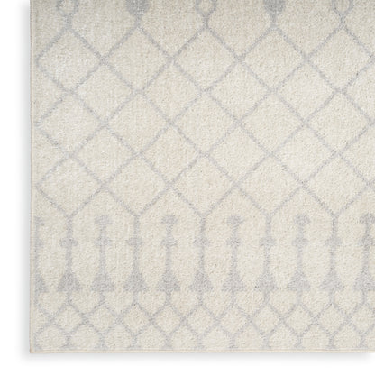 Cream rug with pale gray trellis lattice pattern and decorative border; soft, woven texture for modern living rooms.