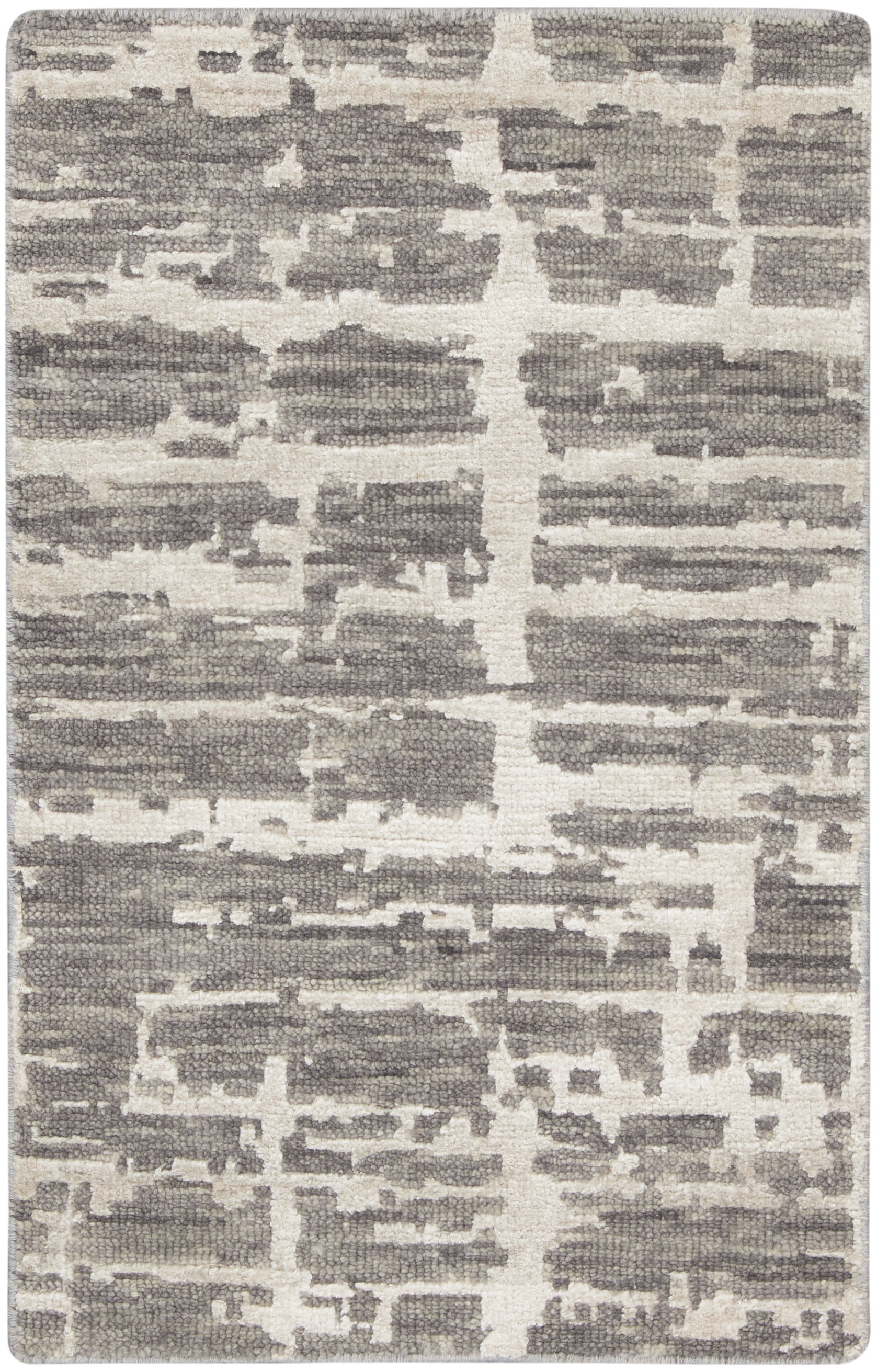 Rectangular rug in gray and ivory with an abstract block pattern; woven texture, contemporary floor decor.