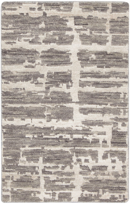 Rectangular rug in gray and ivory with an abstract block pattern; woven texture, contemporary floor decor.