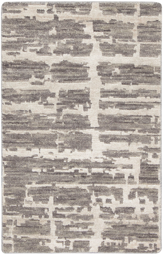 Rectangular rug in gray and ivory with an abstract block pattern; woven texture, contemporary floor decor.