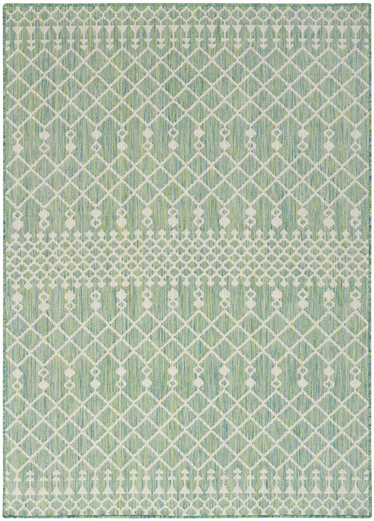 Rectangular mint-green rug with white geometric lattice pattern and dotted borders, woven texture.