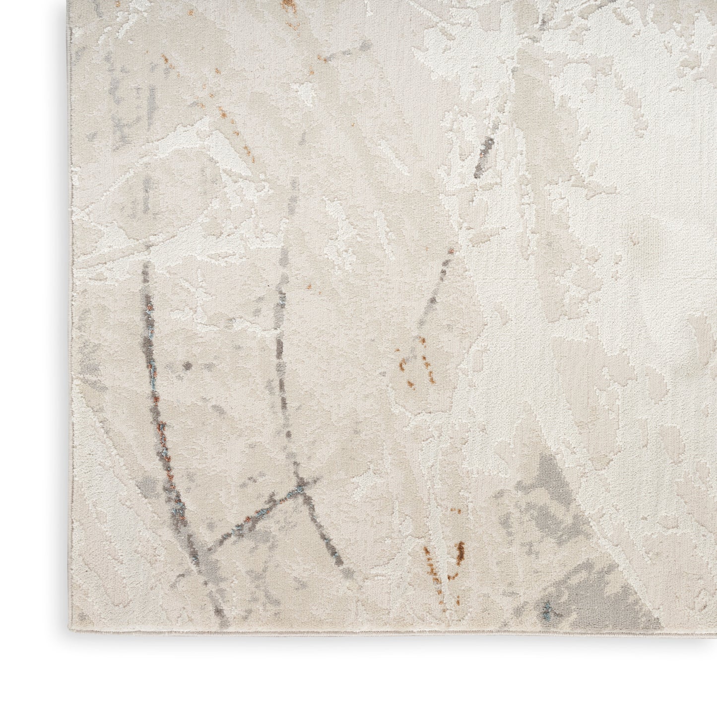 Beige cream textured rug corner with abstract gray and tan marbling in a soft woven pattern.