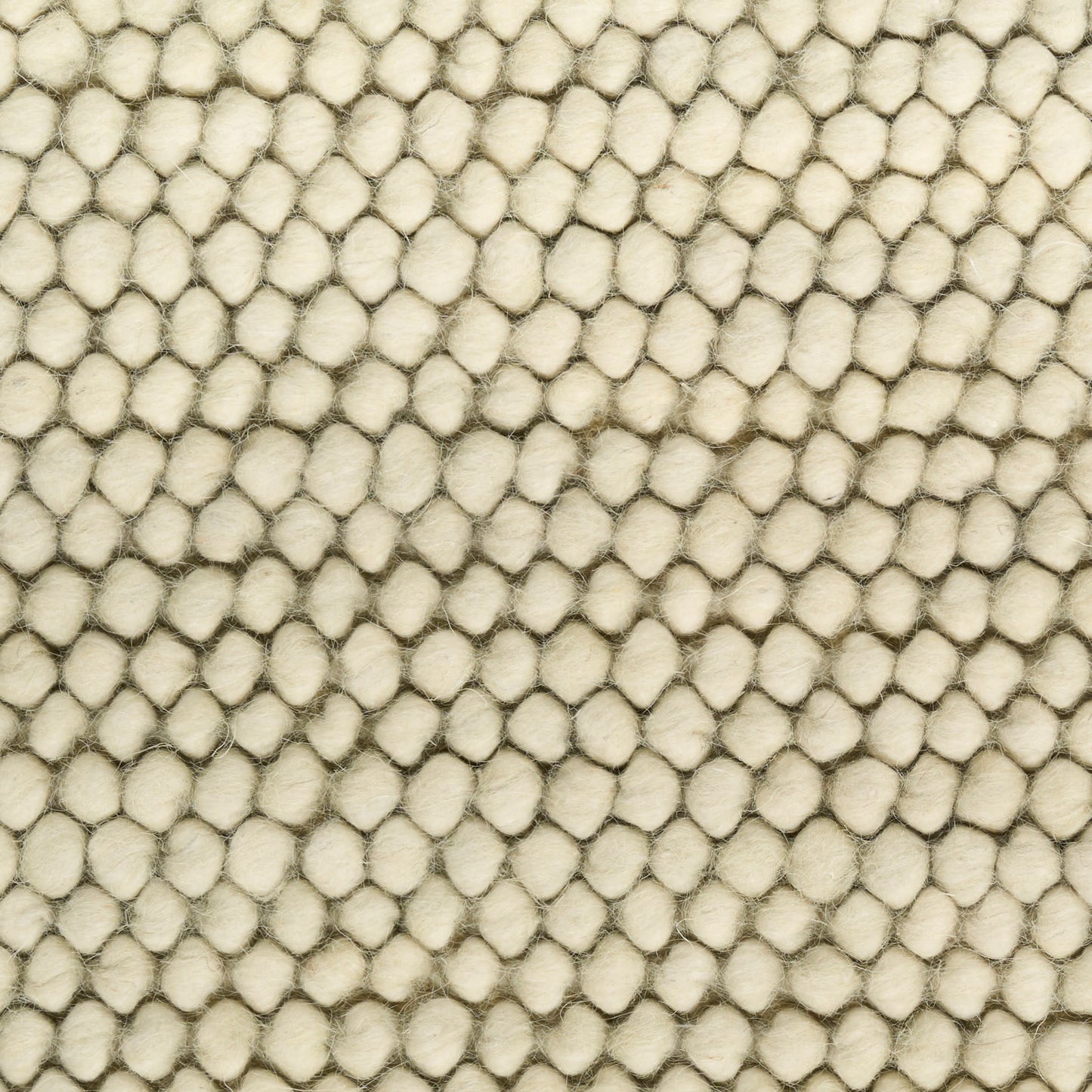 Cream boucle rug close-up with pebble-like raised loops; soft textured surface.