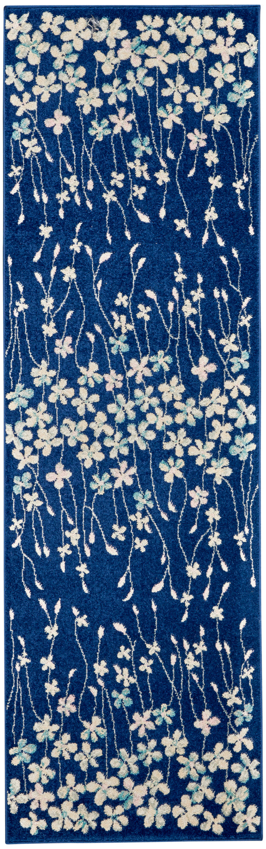 Blue floral runner rug with white and pastel blossoms on twisting stems; long hallway mat with plush textured pile.