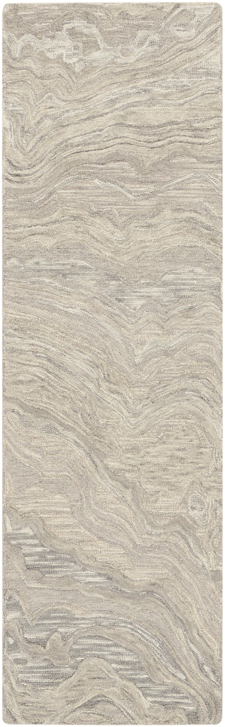 Beige textured area rug with plush pile and subtle tan swirls in a wavy, organic pattern.