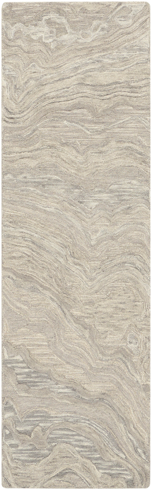 Beige textured area rug with plush pile and subtle tan swirls in a wavy, organic pattern.