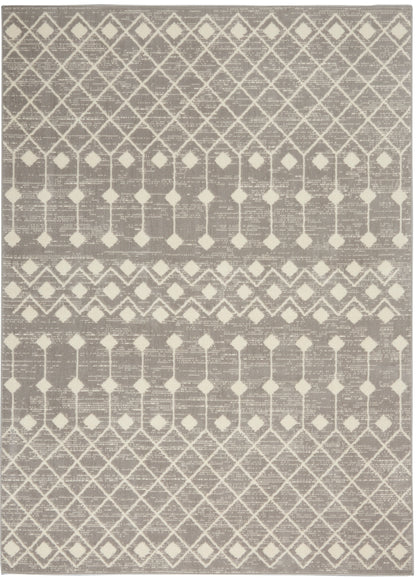 Gray and cream geometric area rug with diamond lattice pattern and woven texture.
