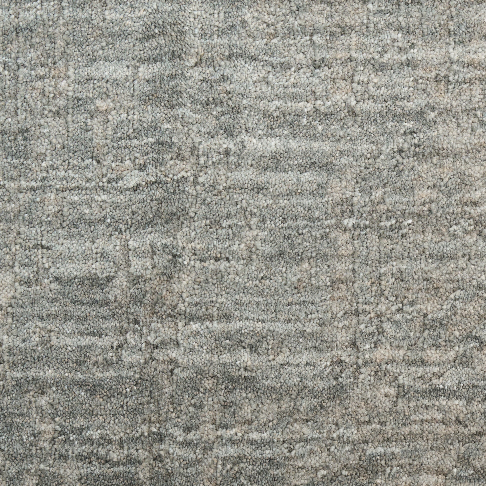 Rectangular textured area rug in gray & beige tones with a soft, distressed pattern.