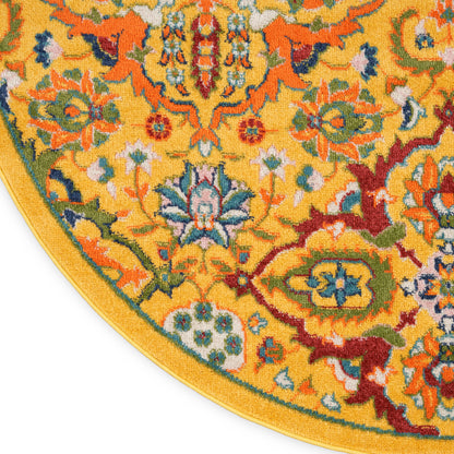 Round decorative rug with vivid yellow field and intricate multicolor floral pattern in blue, green, red; yellow border.