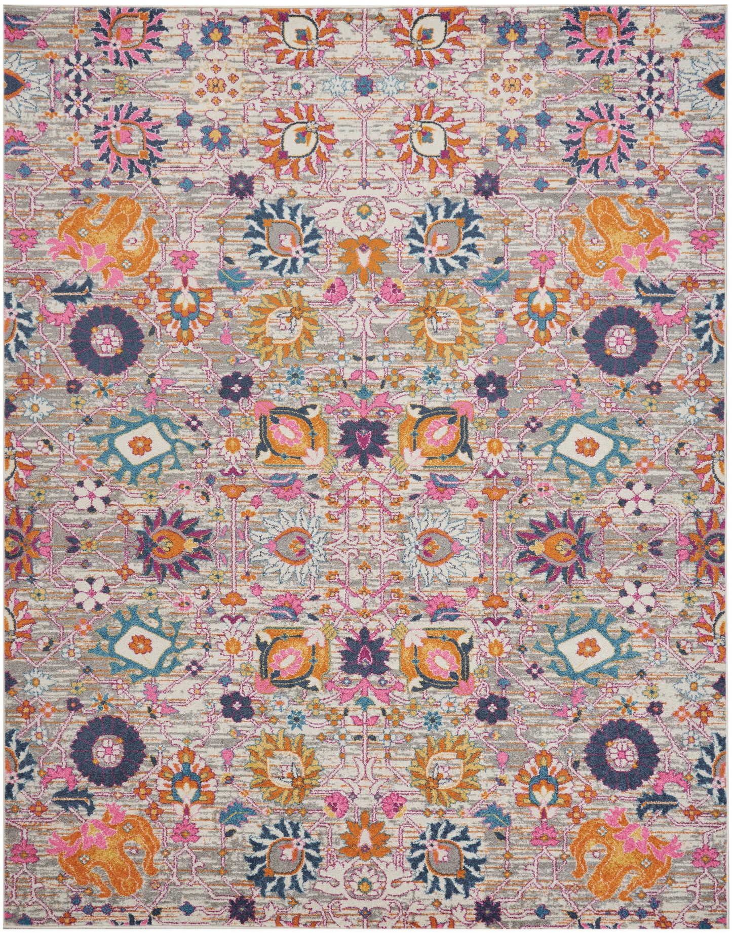 Colorful Bohemian-style rug with pinks, oranges, teals & purples; intricate floral medallion pattern.