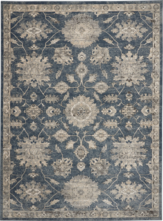 Blue-gray vintage-style rug with cream floral medallions and ornate border; Persian/Oriental design.