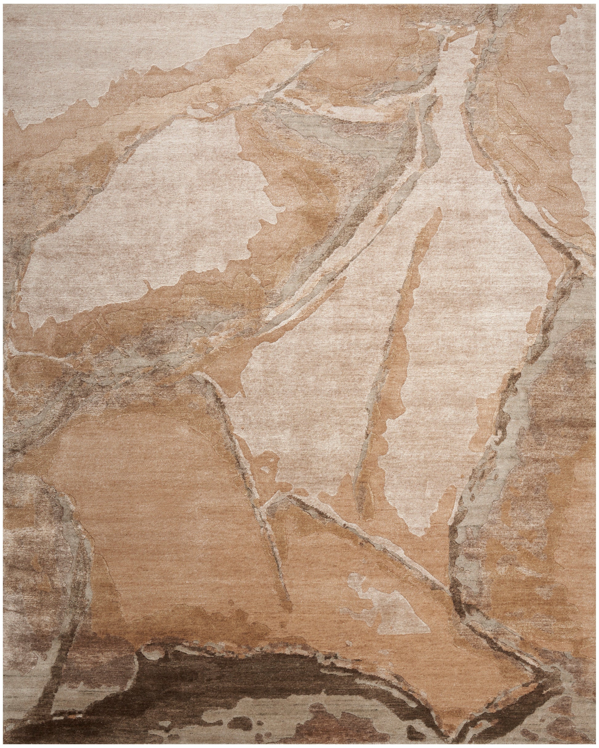 Rectangular area rug with abstract sandstone-toned pattern in beige, tan and brown; distressed, soft-pile texture.