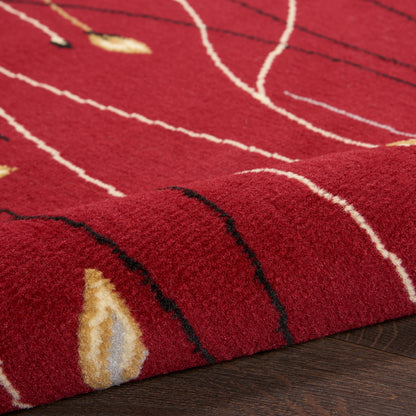 Red plush area rug with abstract white & black curved lines and yellow accents; soft, cozy contemporary decor.