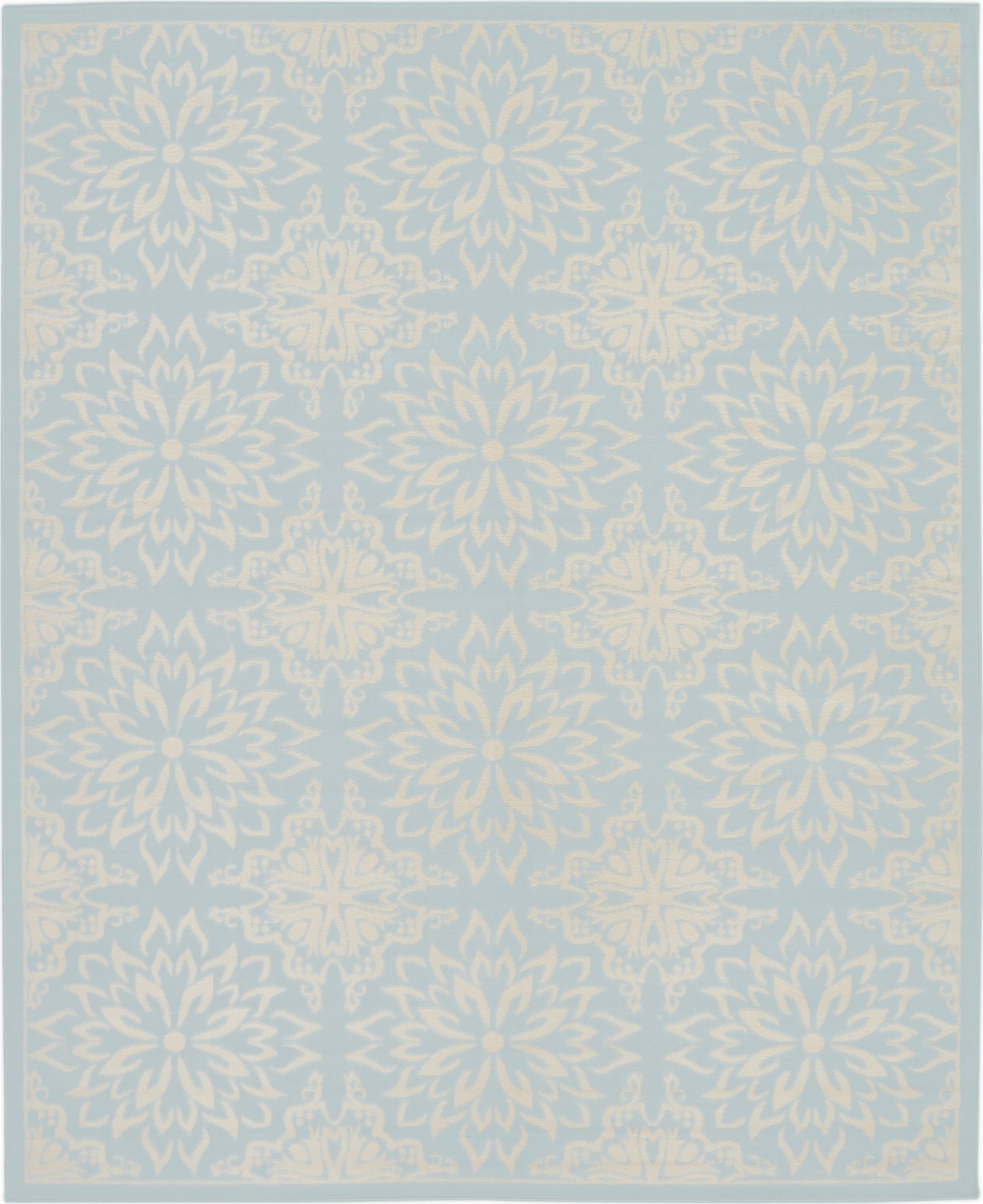 Light blue rug with ivory floral mandala motifs in a repeating border pattern.