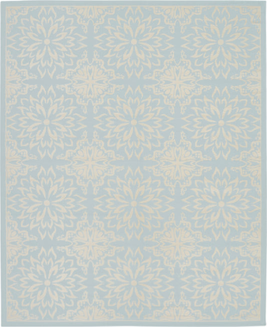 Light blue rug with ivory floral mandala motifs in a repeating border pattern.