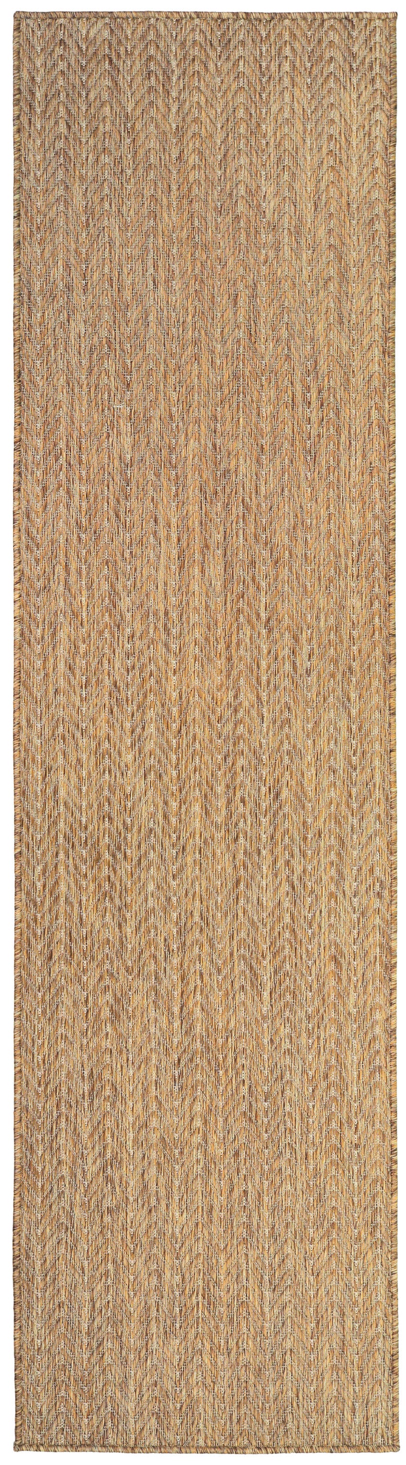 Natural jute runner rug with chevron weave in tan and brown tones.