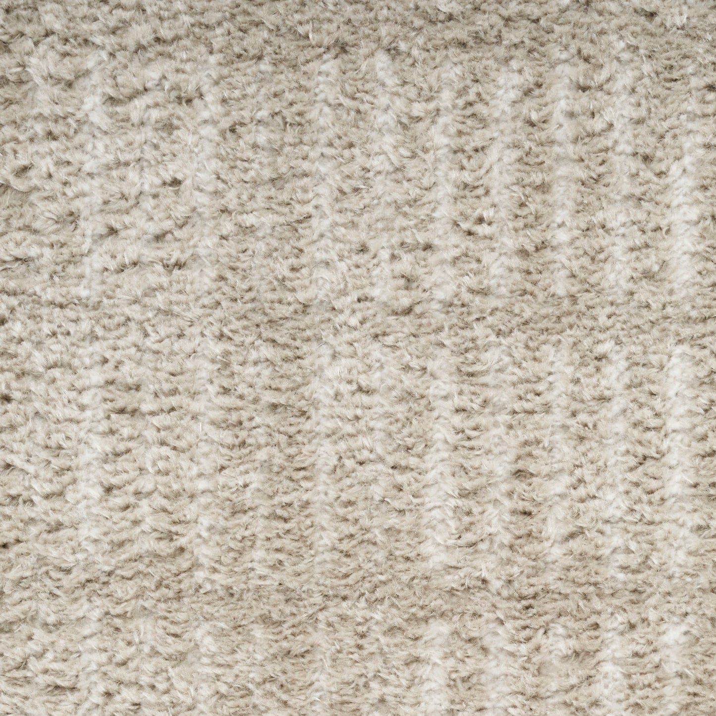 Beige textured carpet with plush looped pile and subtle vertical ribs.