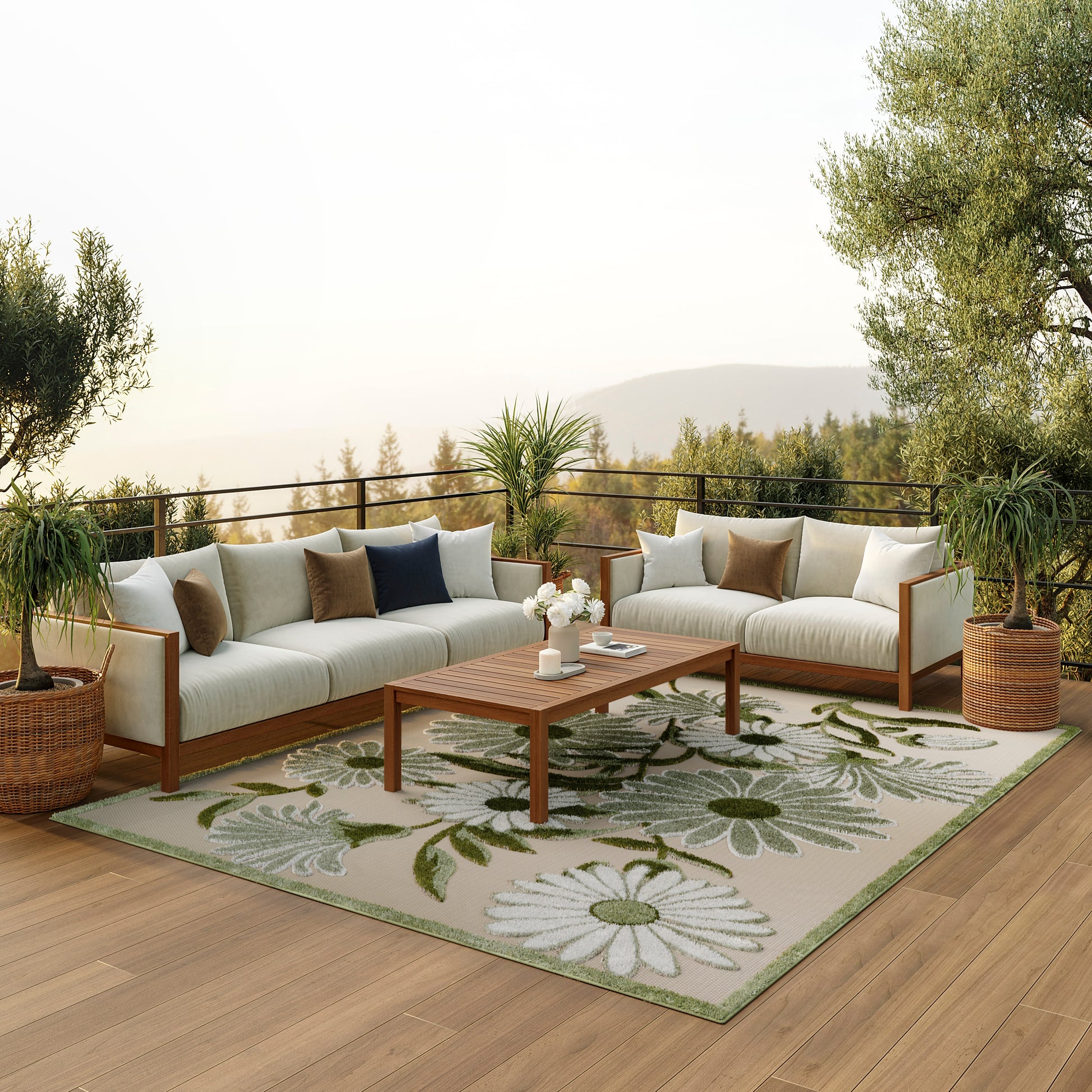 Wood-framed outdoor sectional with cream cushions, brown and navy pillows, on a wooden deck with a floral green rug and coffee table.