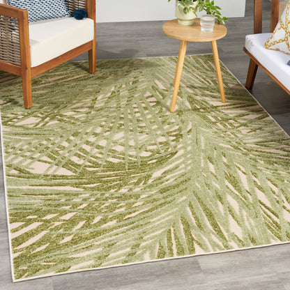 Rectangular beige rug with sage-green palm-leaf pattern; plush pile for living room, tropical mid-century style.