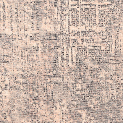 Textured beige and gray abstract geometric area rug with distressed pattern.