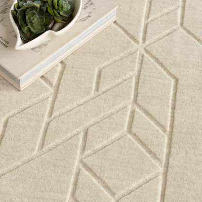 Beige textured rug with raised diamond geometric pattern.