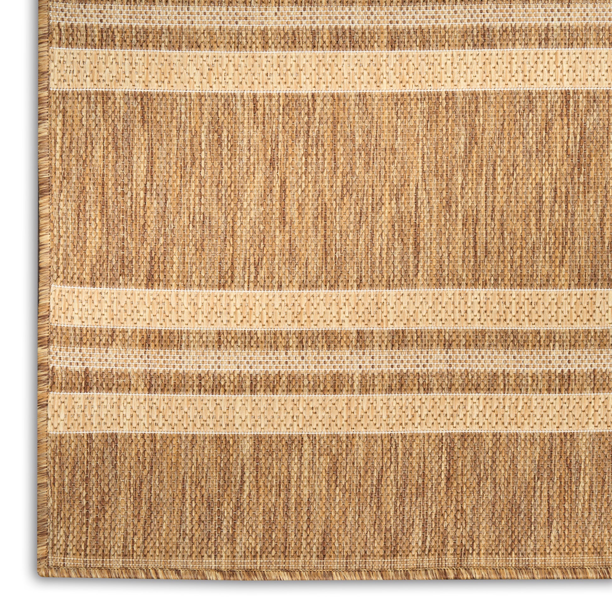 Natural jute rug with beige and brown stripes, woven texture, fringe on left edge.