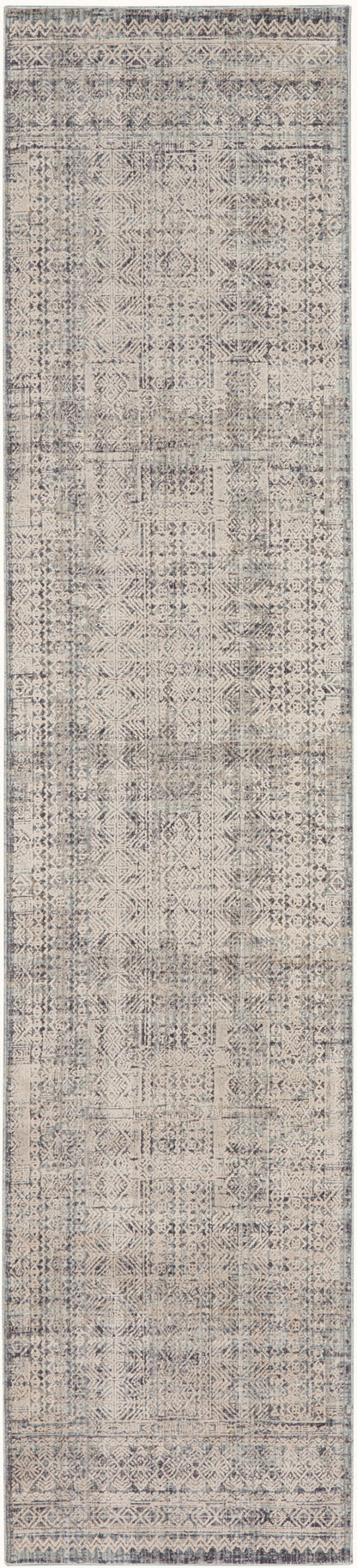 Distressed gray-beige patchwork runner rug with geometric motifs and decorative border.