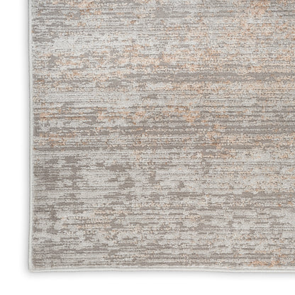 Rectangular area rug with abstract gray and beige pattern, soft textured pile; modern neutral decor for living rooms.