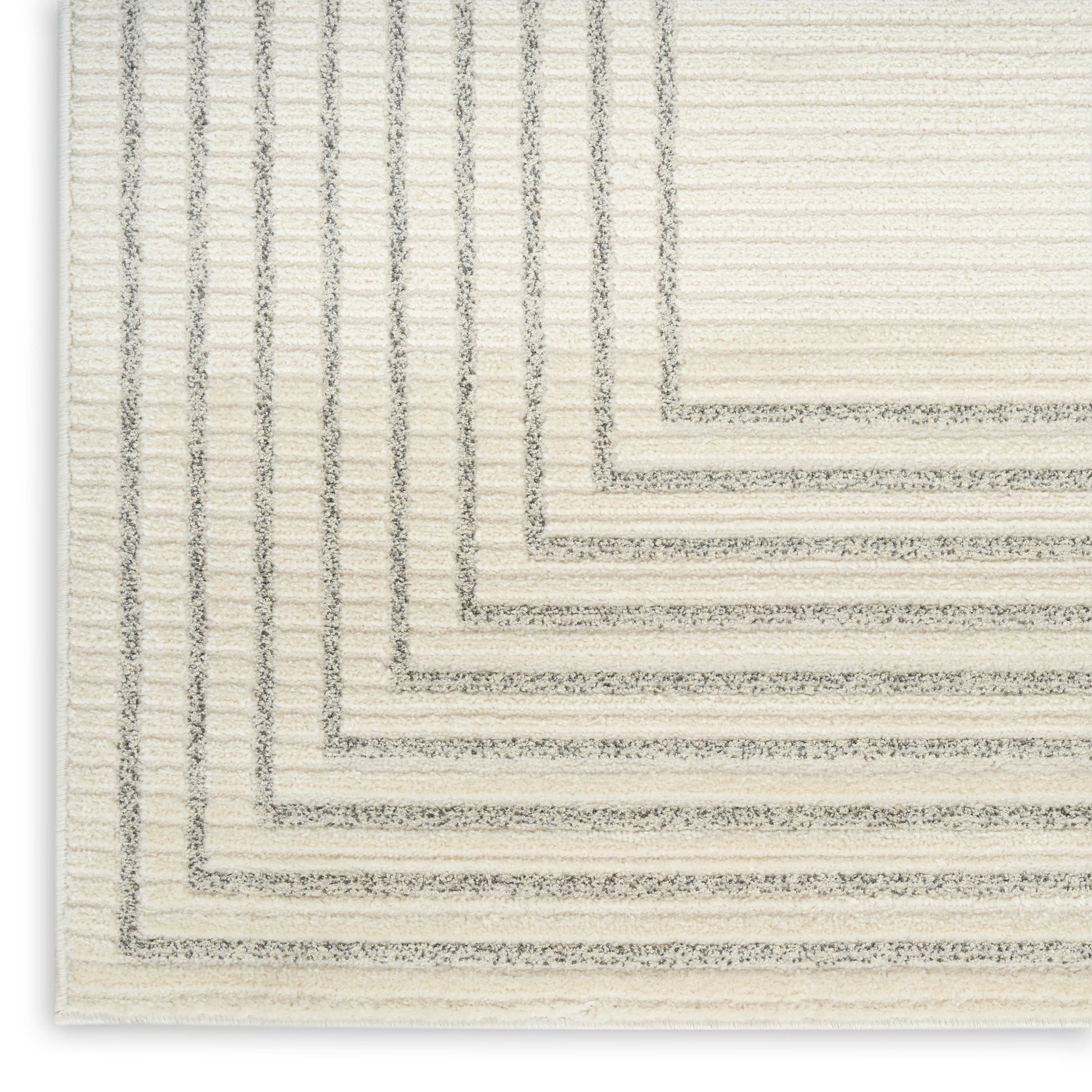 Cream textured area rug with layered grey rectangular border pattern and stepped edges.