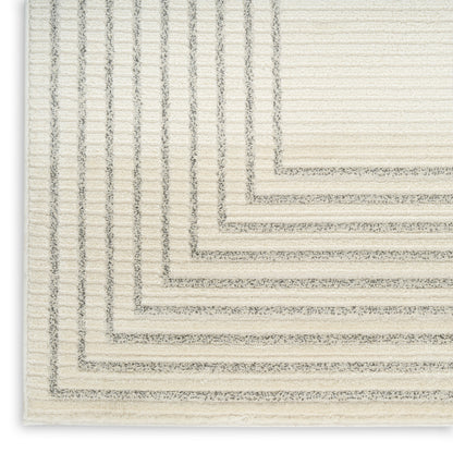 Cream textured area rug with layered grey rectangular border pattern and stepped edges.