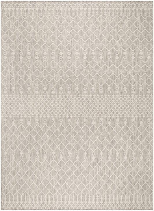 Neutral beige rug with white diamond lattice pattern and a central dotted band; woven flat-weave look.