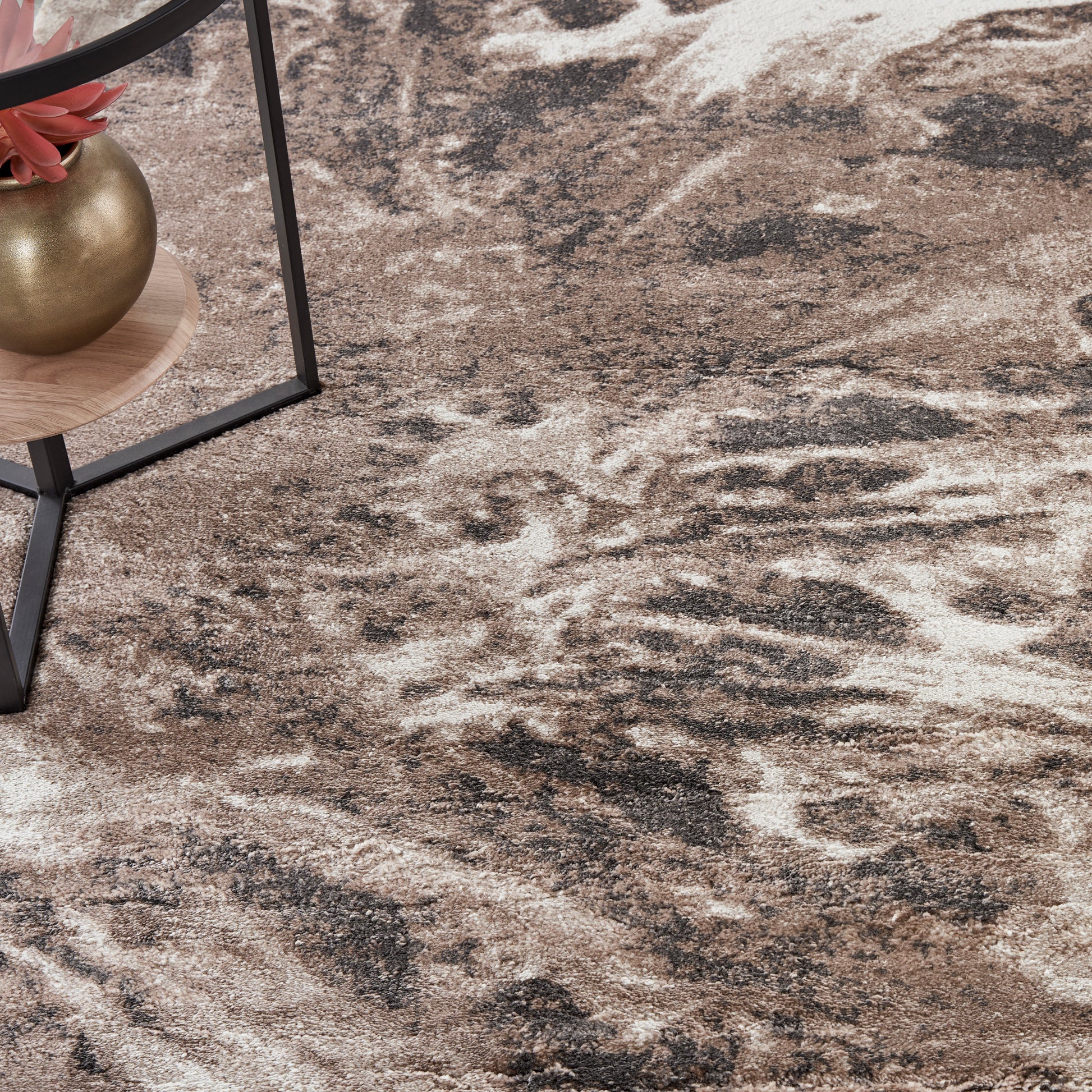 Abstract brown-beige area rug with cream and charcoal marbling; modern rustic living room floor decor.