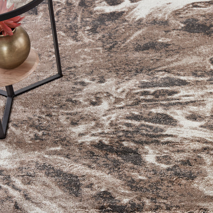 Abstract brown-beige area rug with cream and charcoal marbling; modern rustic living room floor decor.