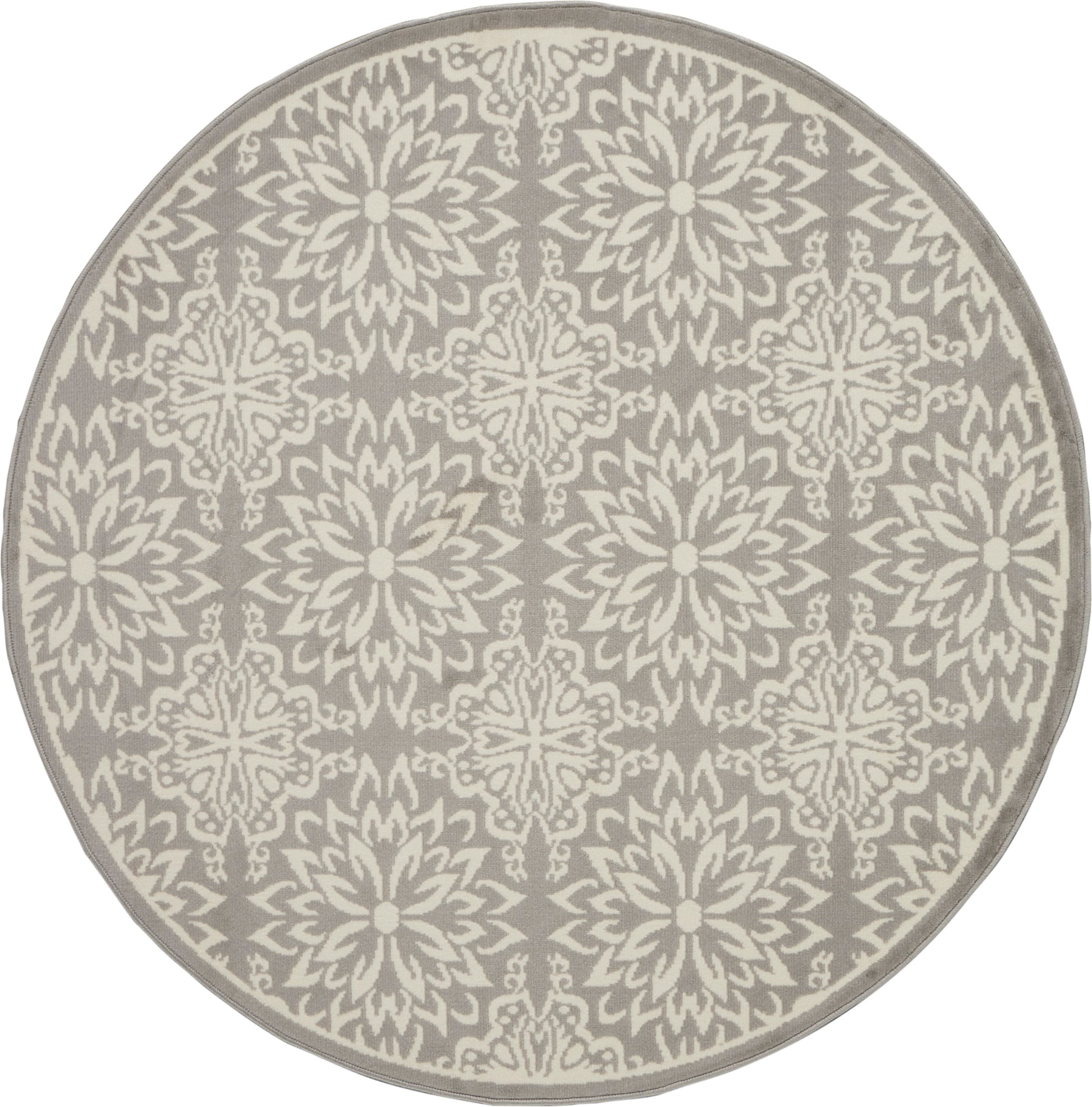 Round taupe rug with cream ornate repeating floral starburst pattern; decorative, modern-traditional style.