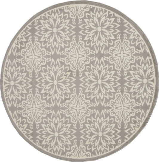 Round taupe rug with cream ornate repeating floral starburst pattern; decorative, modern-traditional style.