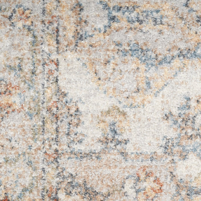 Cream and tan shag rug with abstract blue and orange accents, plush textured pile.