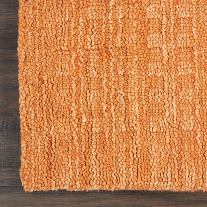 Orange shag 8-foot runner rug with thick loop pile on dark wood floor; plush cozy living room accent.