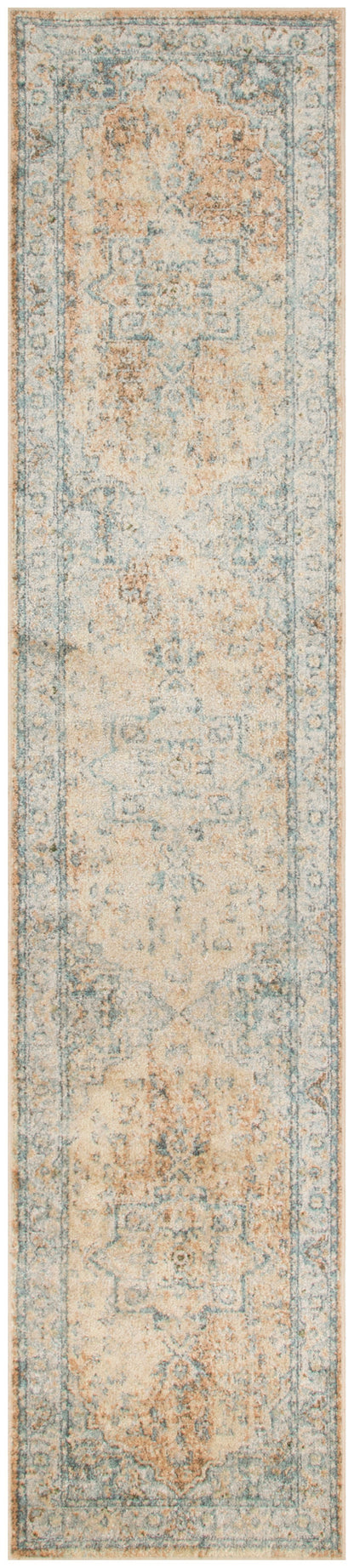 Long oriental-style runner rug with pale blue and peach faded motifs, ornate border, vintage distressed look.
