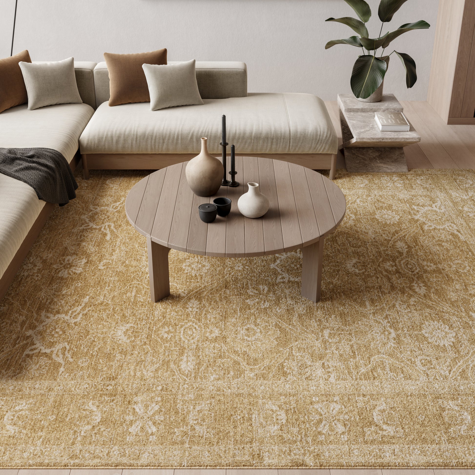 Round wooden coffee table with slatted top in a beige living room; sectional with tan/cream cushions, yellow rug, vases.