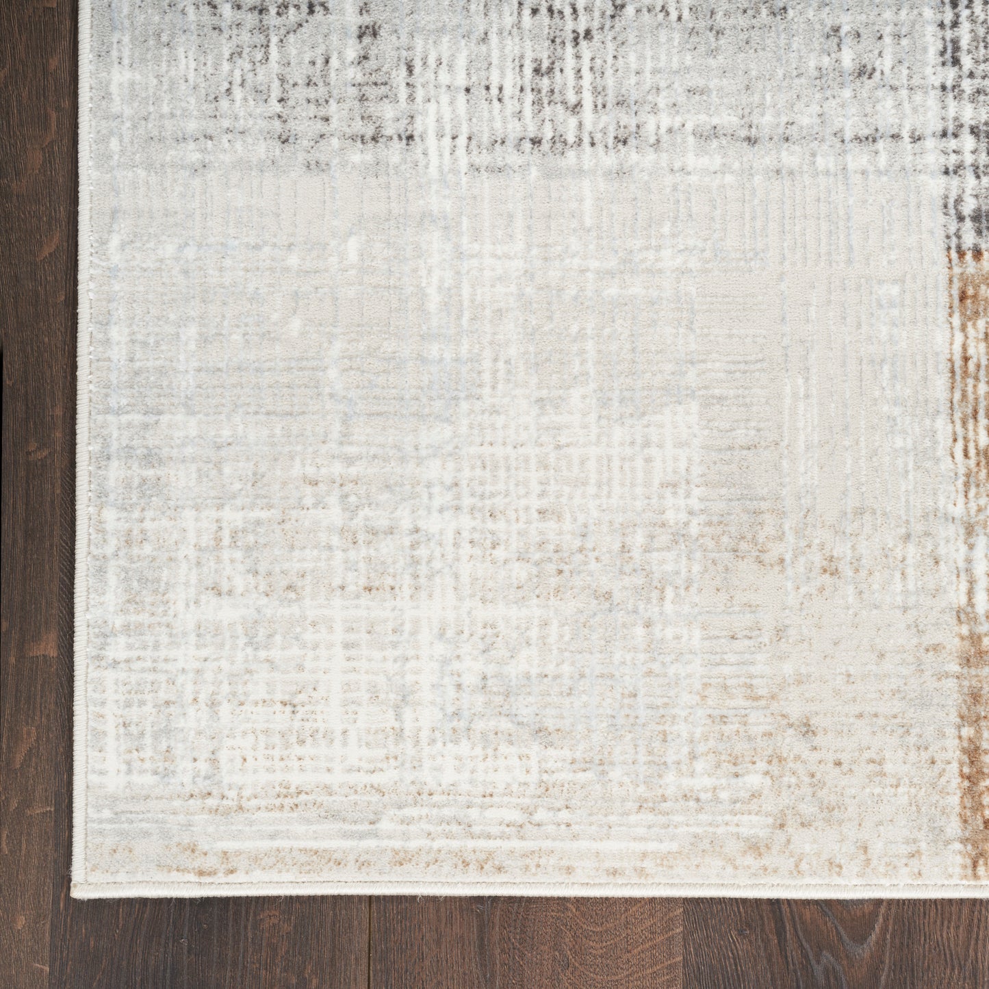 Cream and beige distressed runner rug with a subtle grey pattern on dark wood floor; rectangular, low-pile, 8' runner.