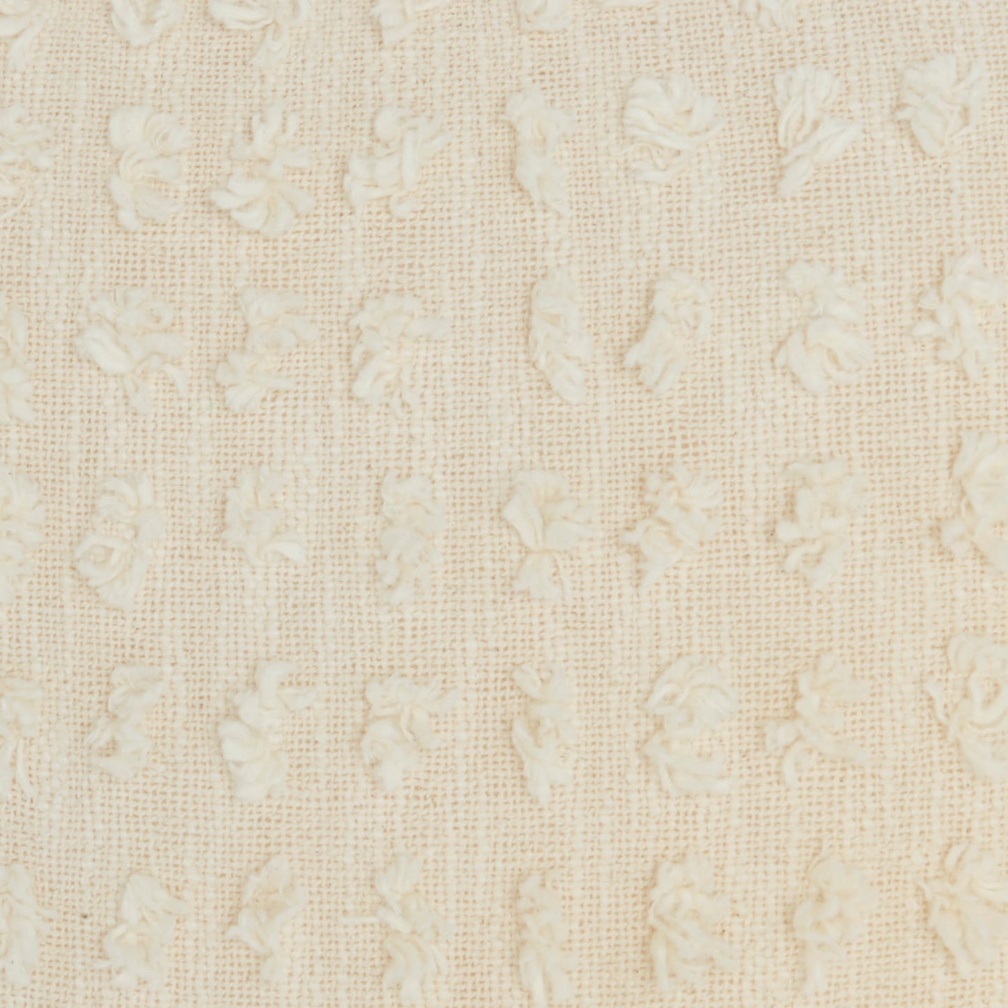 Cream-colored woven fabric with tiny raised floral motifs and a soft damask-like texture, suitable for upholstery or curtains.