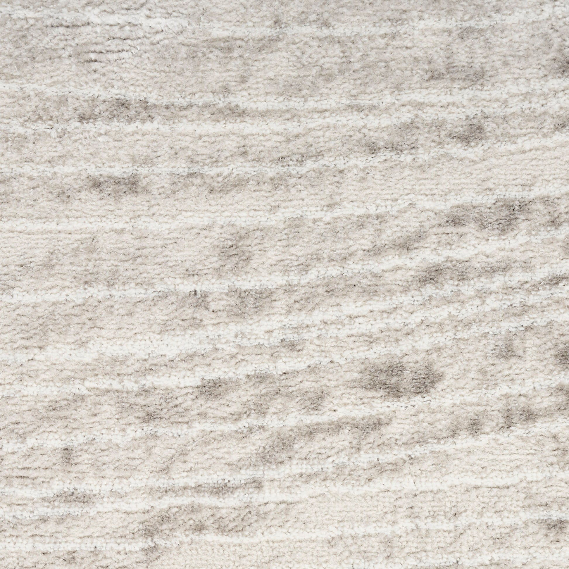 Beige textured rug with soft plush pile and subtle wavy pattern.
