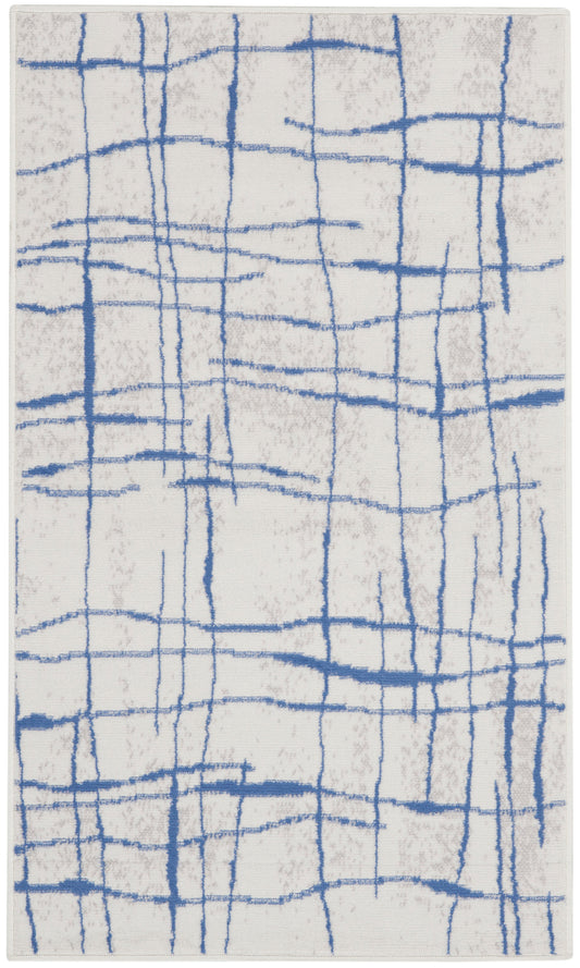 Abstract blue grid-lined area rug on beige background; modern geometric decor for living room.