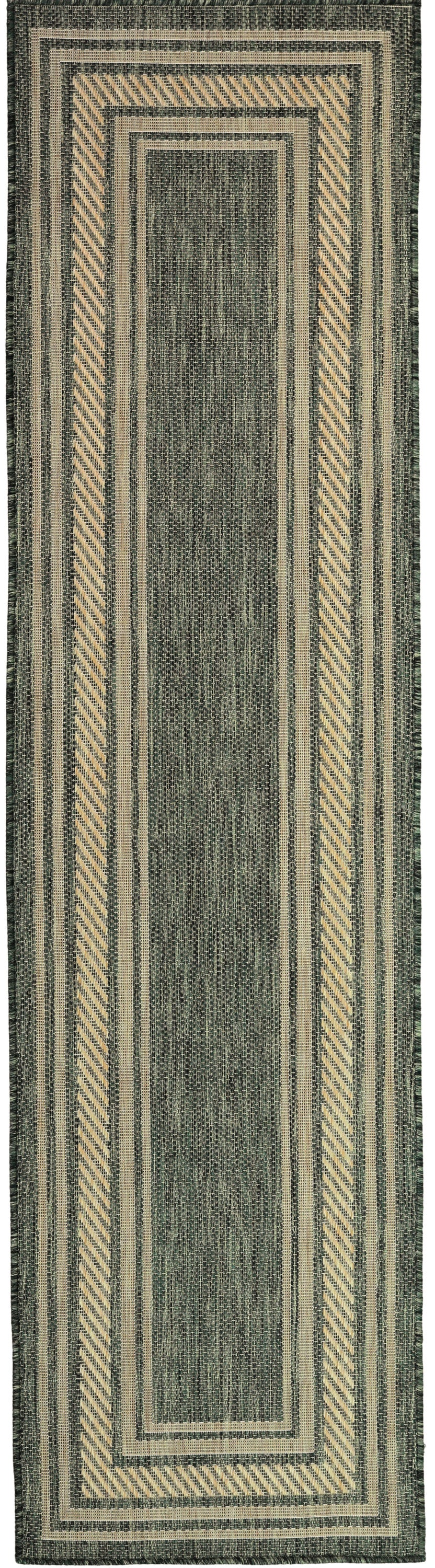 Green woven runner rug with beige framed rectangles, chevron borders, and striped outer edges.
