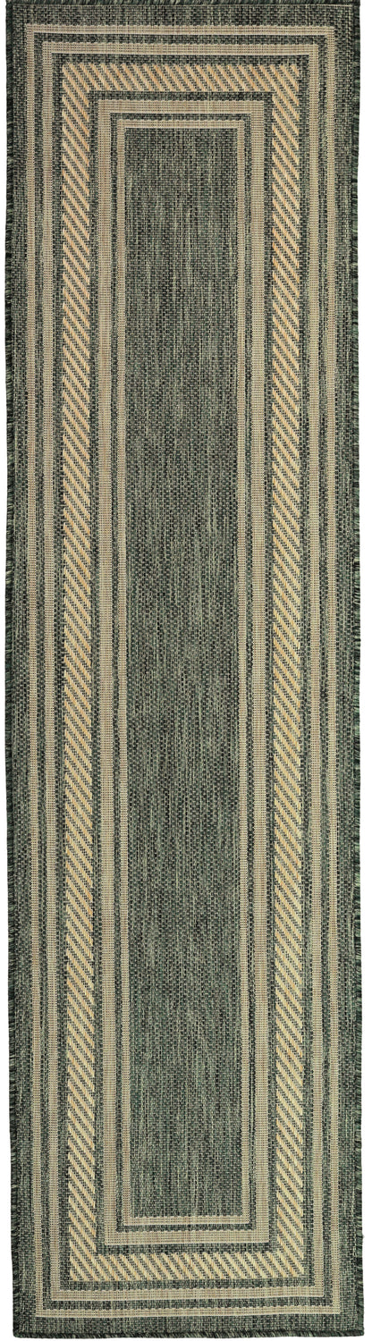Green woven runner rug with beige framed rectangles, chevron borders, and striped outer edges.