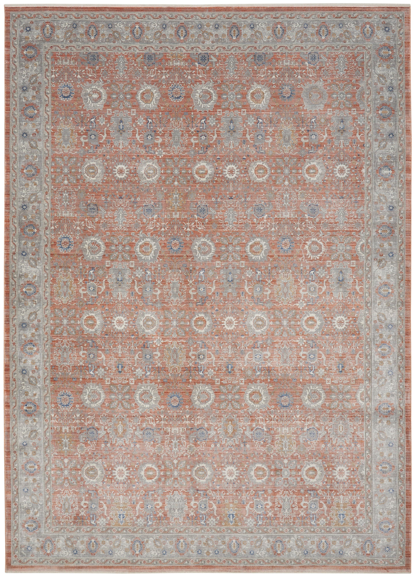 Rectangular oriental rug with peach field and ivory-blue floral medallions; pale gray-blue border in vintage Persian style.