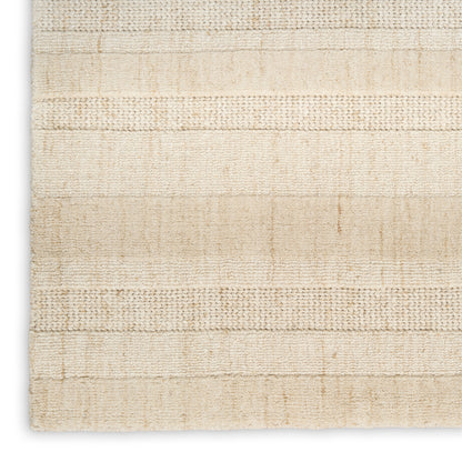 Beige textured woven rug with subtle horizontal stripes and natural fiber look.